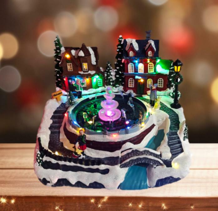 Коледна декорация със светлини и воден фонтан  зимна приказка за ваши